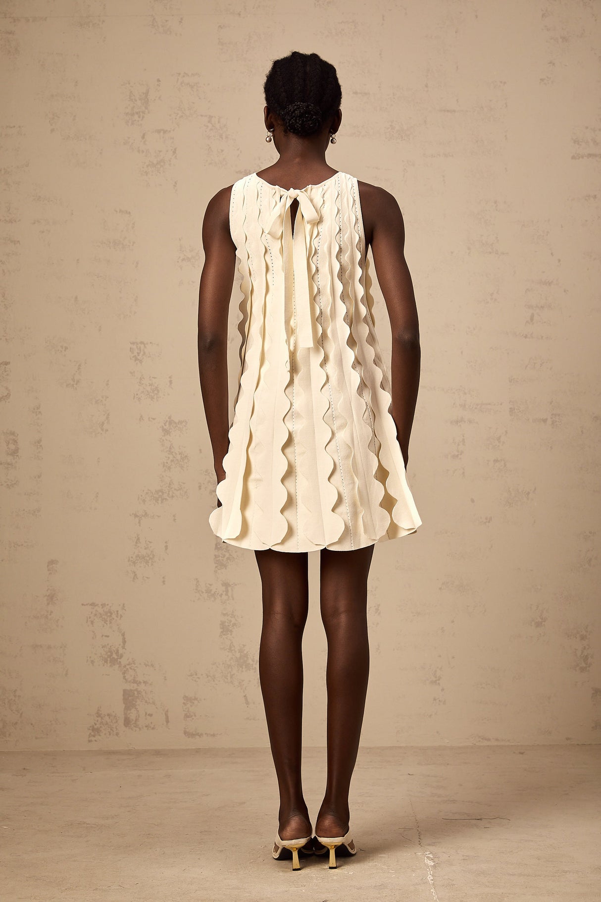 Aurohaya Axelle white wavy-detail sleeveless mini dress