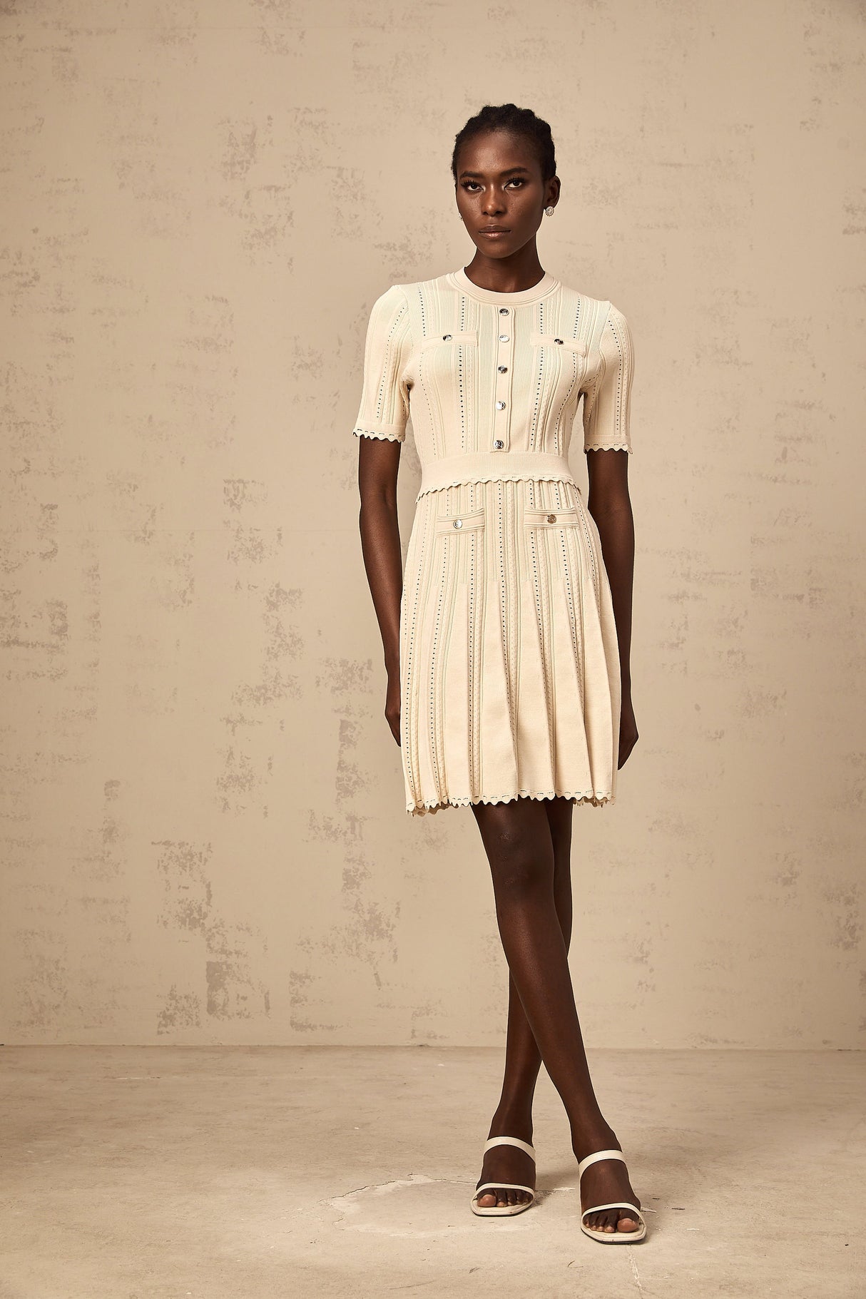 Aurohaya Amélie neutrals pointelle-trim pleated knit mini dress