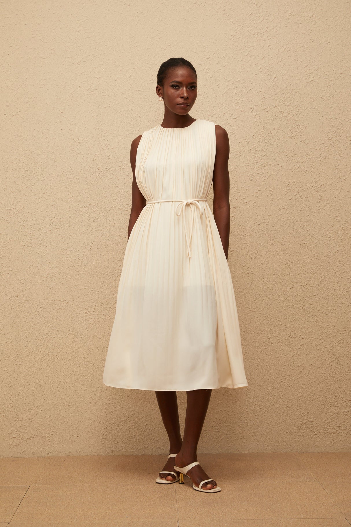 Aurohaya Célestine Neutral Sleeveless Pleated Midi Dress
