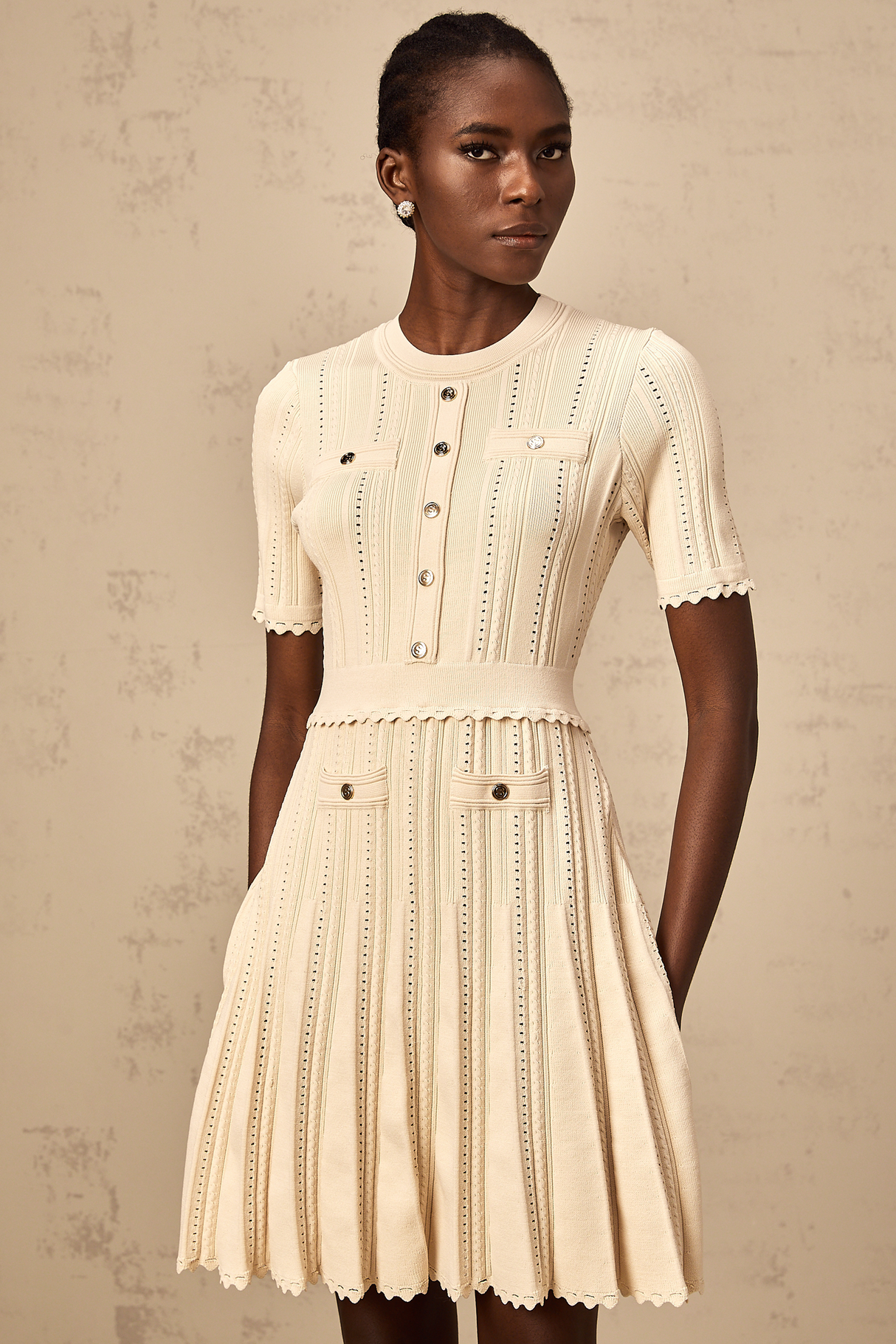 Aurohaya Amélie neutrals pointelle-trim pleated knit mini dress