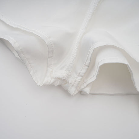 Aurohaya Aurélie white halterneck ruffled mini dress