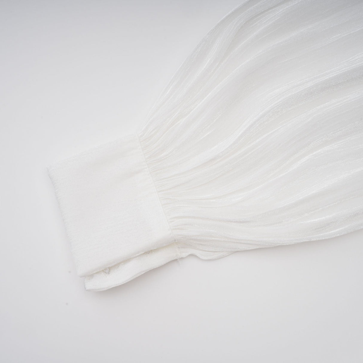 Aurohaya Mahault white pleated glitter-effect mini dress