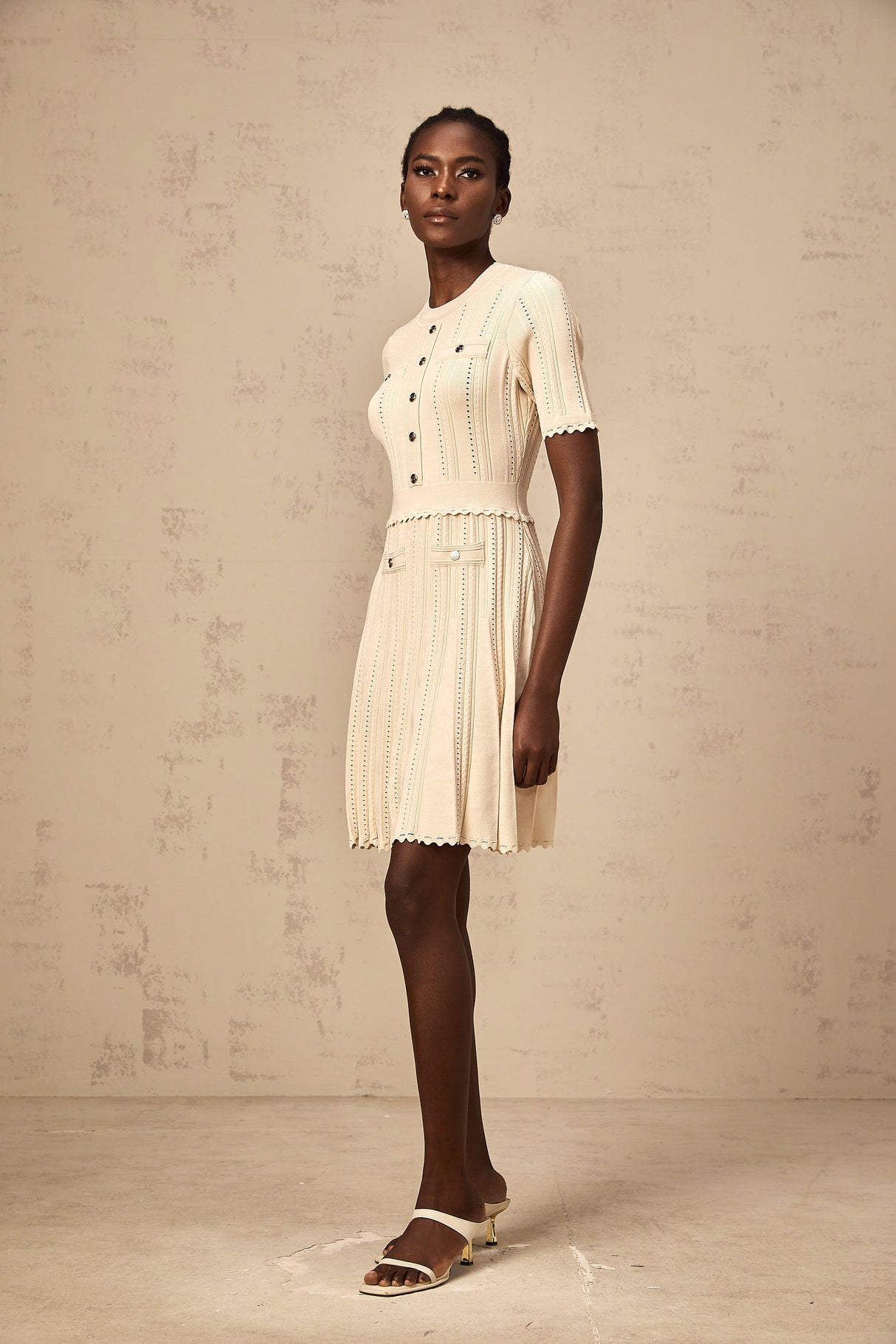 Aurohaya Amélie neutrals pointelle-trim pleated knit mini dress