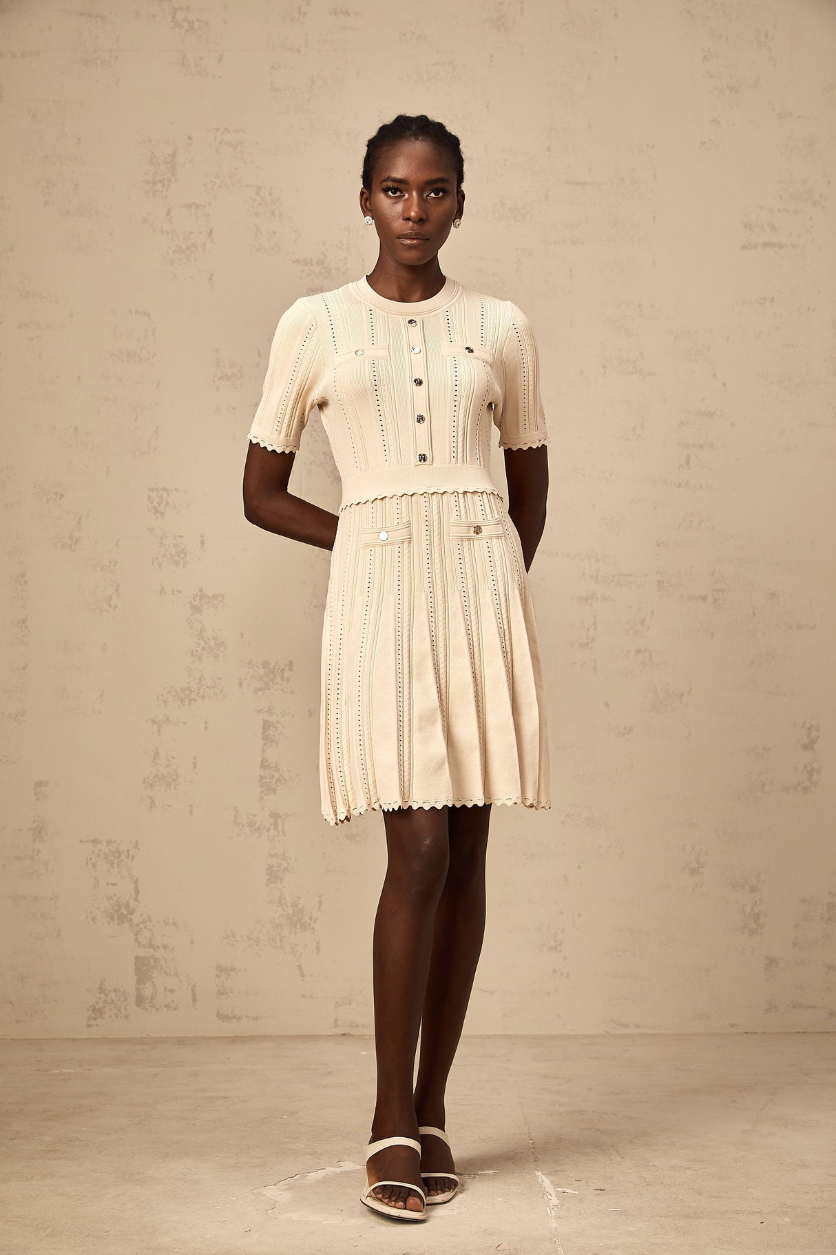 Aurohaya Amélie neutrals pointelle-trim pleated knit mini dress