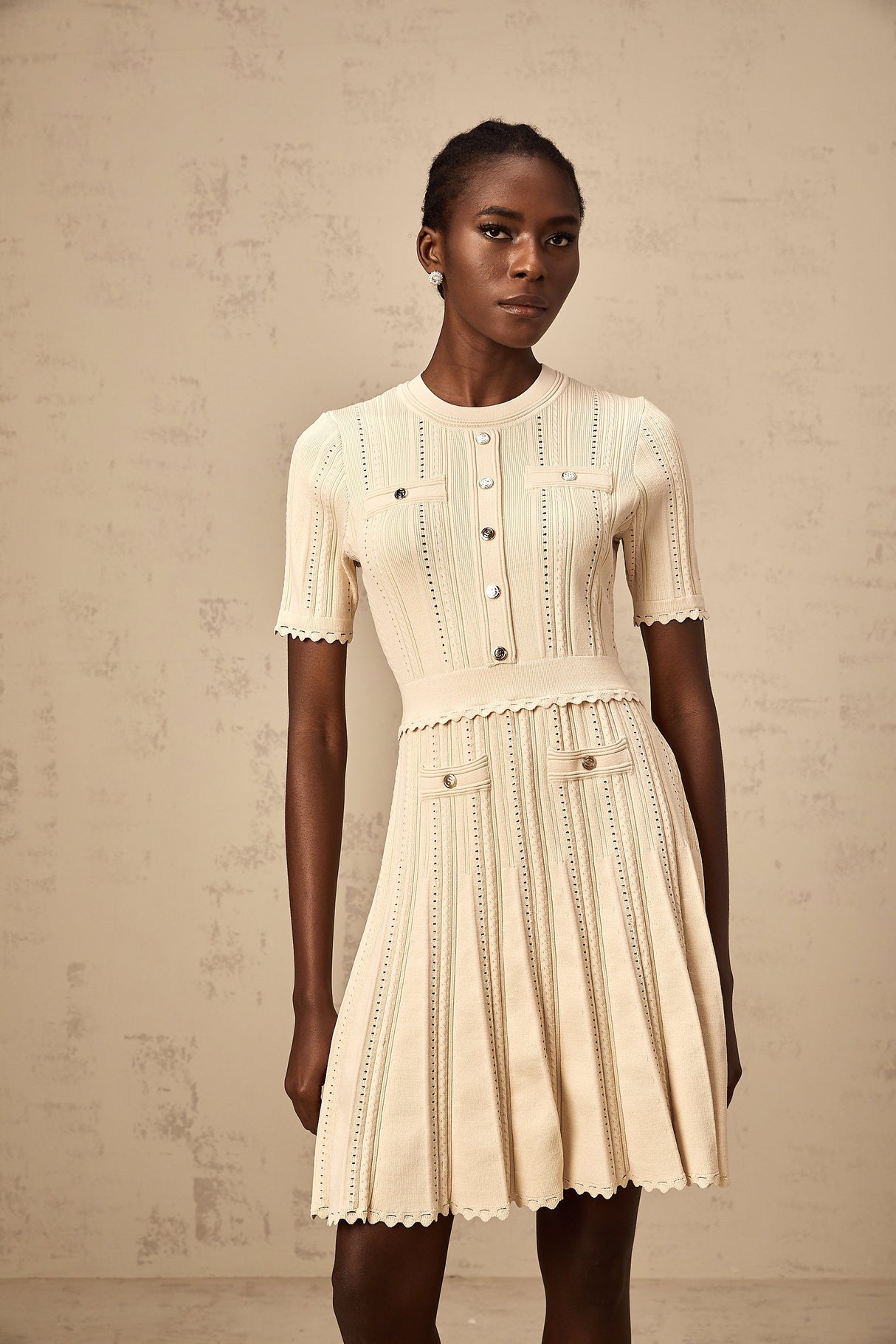 Aurohaya Amélie neutrals pointelle-trim pleated knit mini dress
