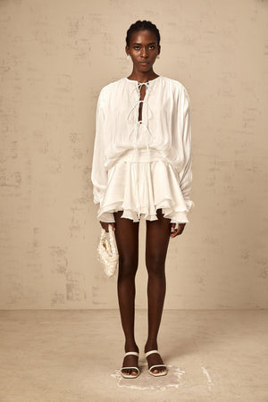 Aurohaya Mahault white pleated glitter-effect mini dress