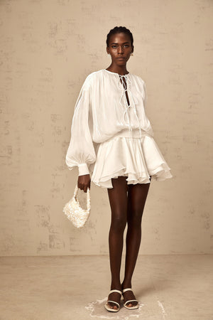 Aurohaya Mahault white pleated glitter-effect mini dress