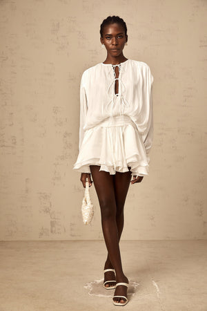 Aurohaya Mahault white pleated glitter-effect mini dress