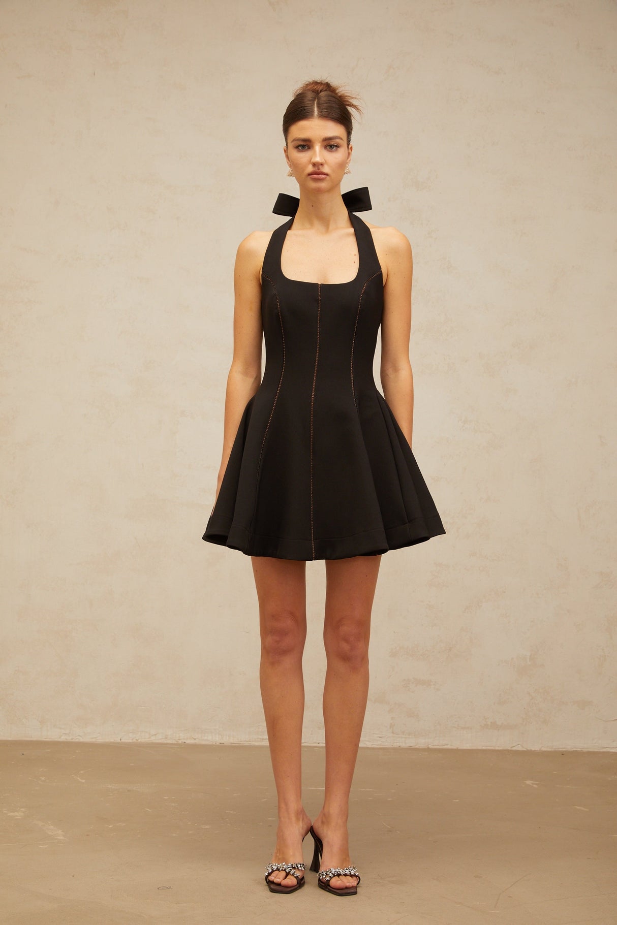 Aurohaya Quirine halterneck bow-detail mini dress in Black