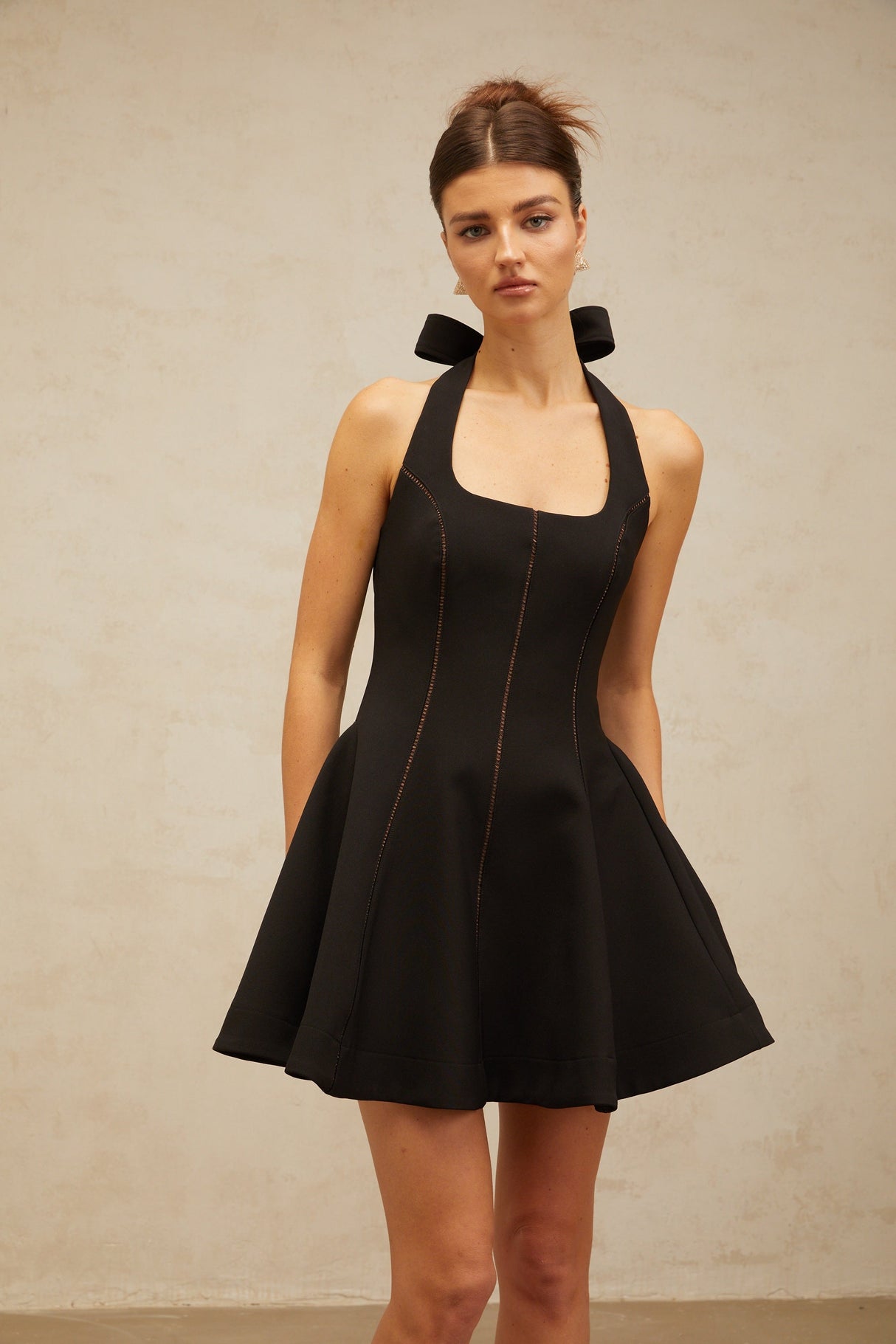 Aurohaya Quirine halterneck bow-detail mini dress in Black