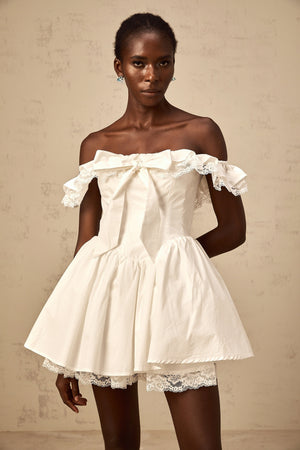 Aurohaya Arsène white oversize-bow ruffled mini dress