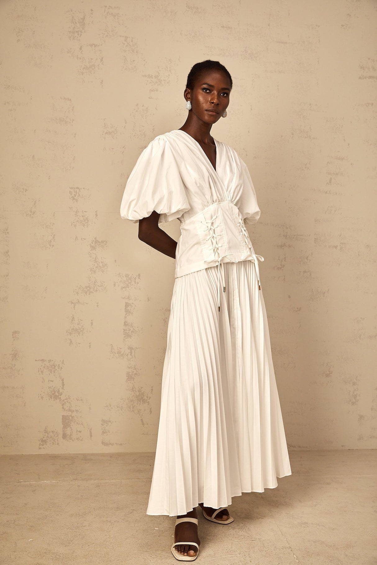 Aurohaya Vienne White Lace-Up Pleated Maxi Dress