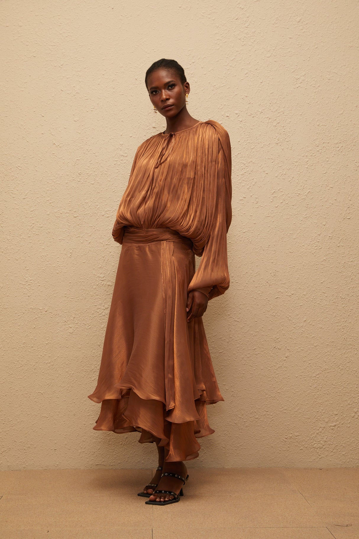 Aurohaya Eugénie Pleated Ruffle Maxi Dress in Brown