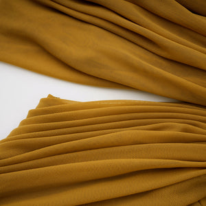 Aurohaya Ludivine ocher off-shoulder cut-out ruched maxi dress