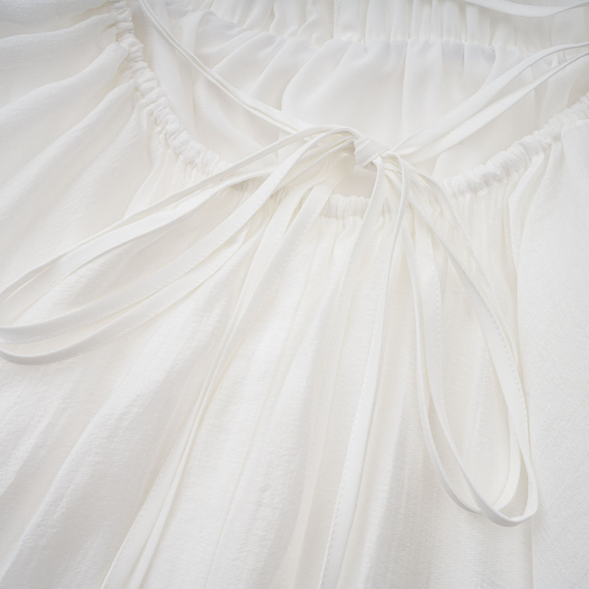 Aurohaya Quincie white shirred flounced mini dress