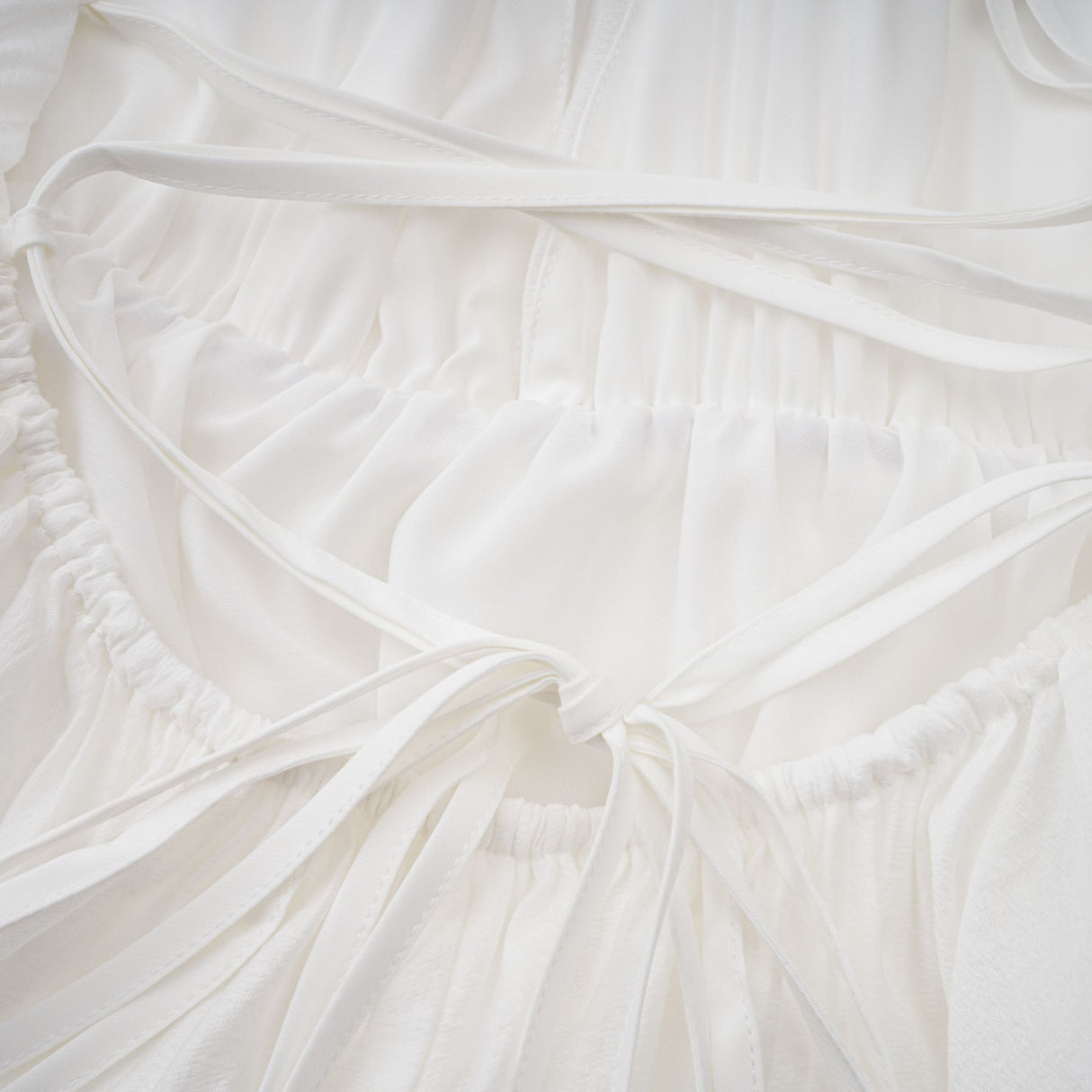 Aurohaya Quincie white shirred flounced mini dress
