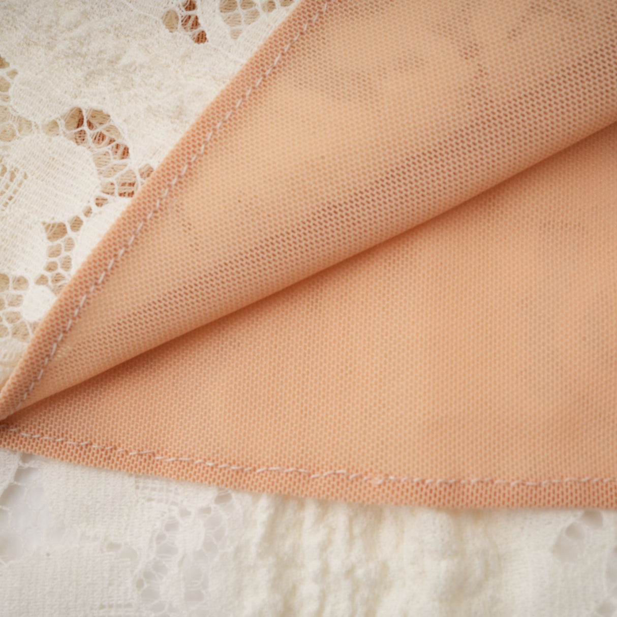Aurohaya Émeline floral lace flared-cuff mini dress in Neutrals