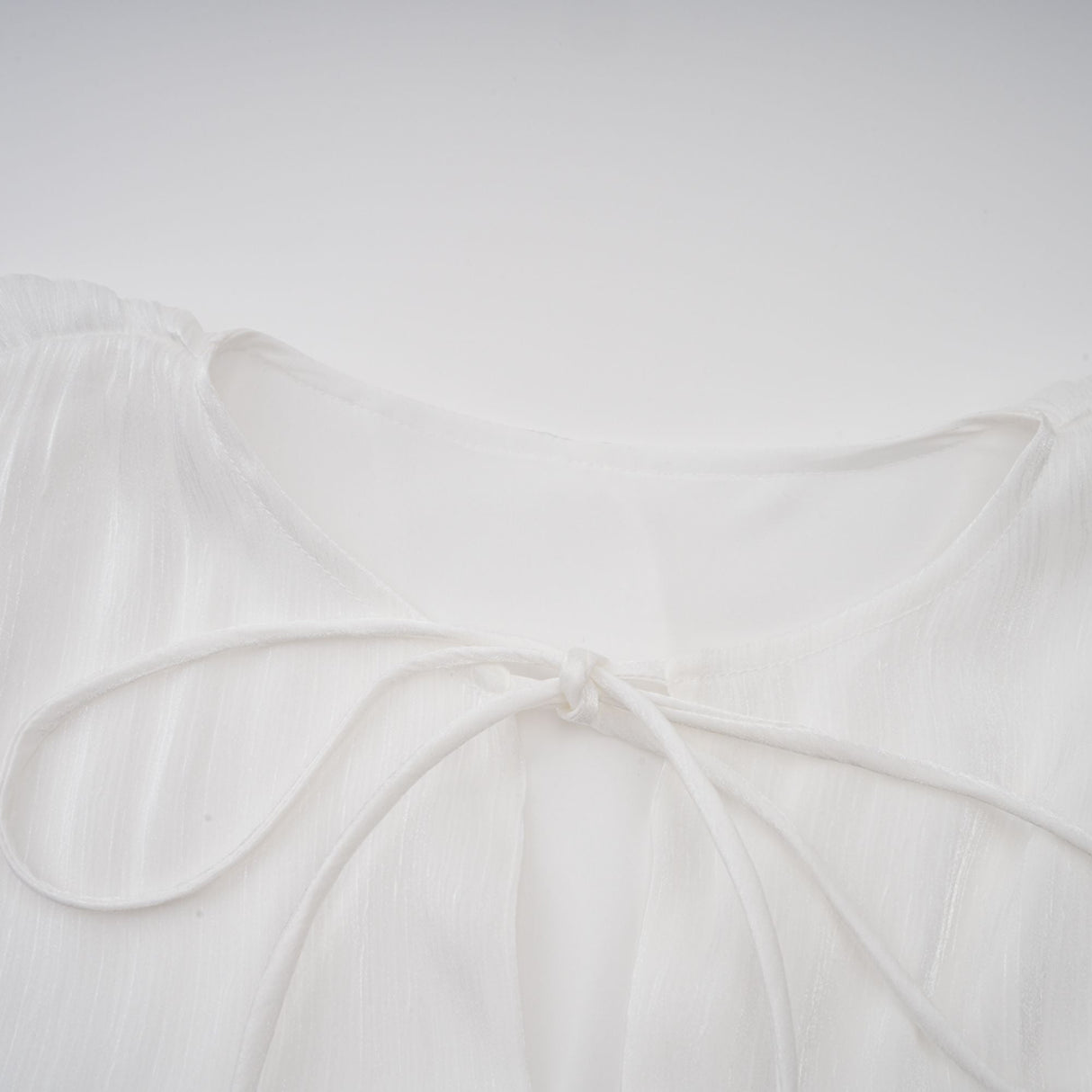 Aurohaya Mahault white pleated glitter-effect mini dress