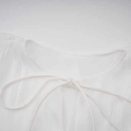 Aurohaya Mahault white pleated glitter-effect mini dress