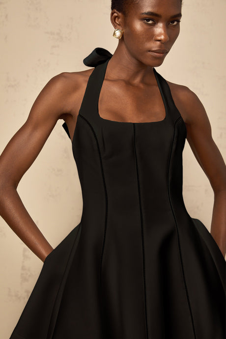 Aurohaya Quirine halterneck bow-detail mini dress in Black