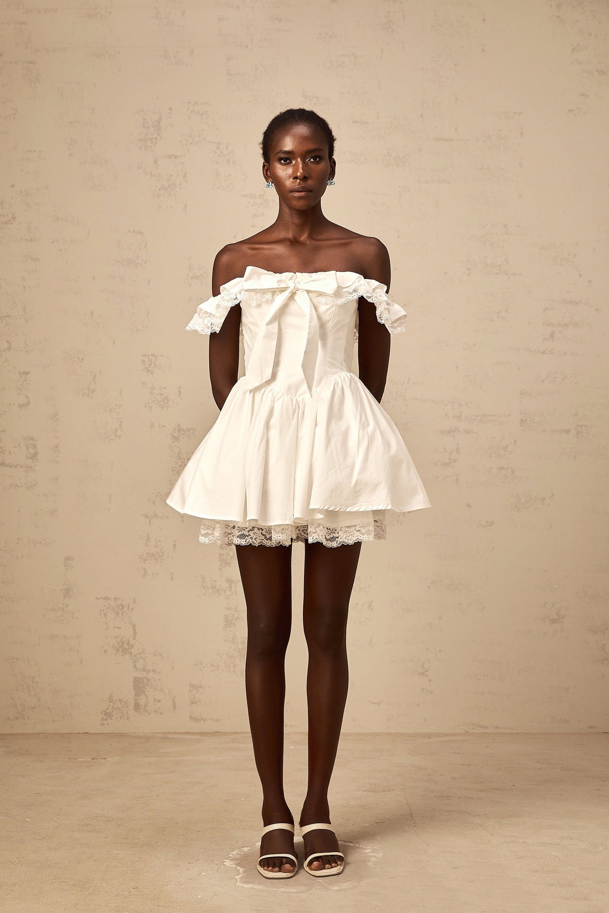 Aurohaya Arsène white oversize-bow ruffled mini dress